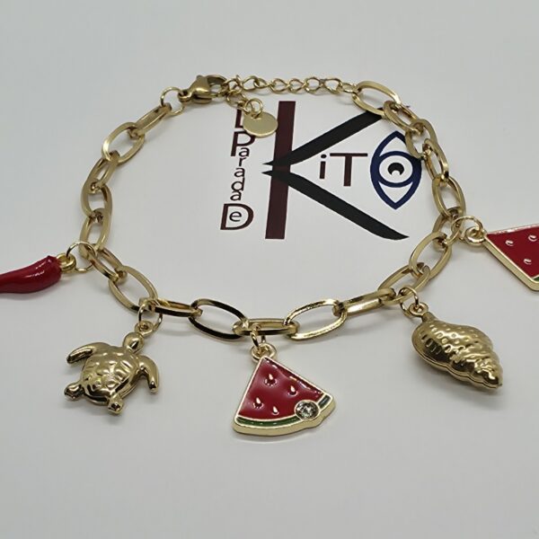 Pulsera de acero dorado con colgantes frutales y marinos